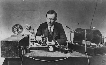 Guglielmo Marconi, with his receiver (left) and transmitter (right), c. 1890